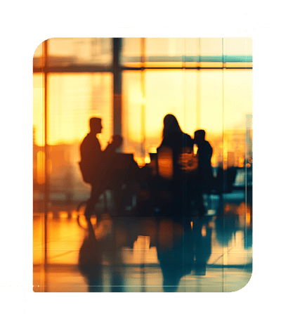 blurry photo of a group at a table talking.